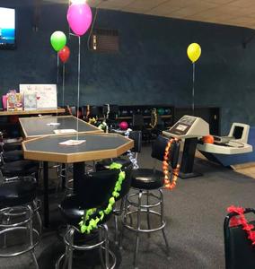 Balloons and party tables set up at 281 Bowl