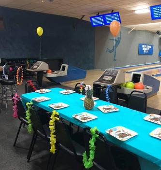 A birthday party set up on the lanes at 281 Bowl with a decorated table